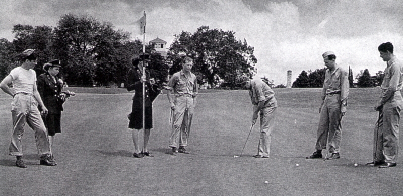 Soldiers from Camp Gordon, with WAC caddies, putting at Augusta National in 1942, before the club closed for the duration. You can see the clubhouse in the background.