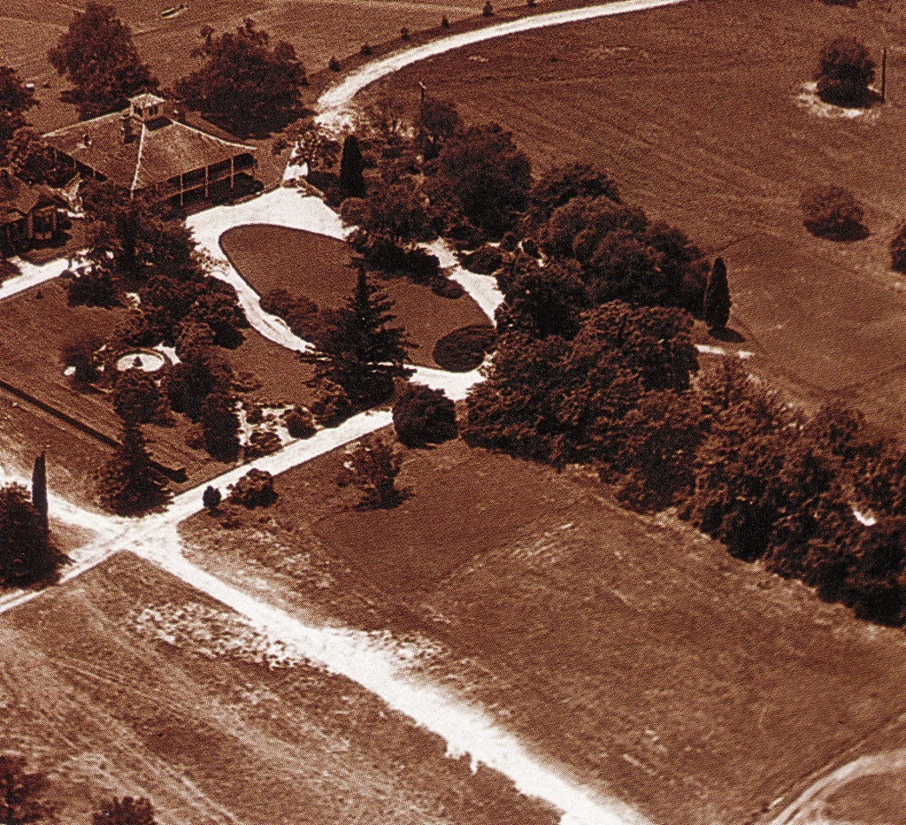 The magnolia trees are on the right side of this  photograph, which was taken around the time of the first tournament. The road that Roberts and Jones considered using as the club's driveway is at the lower left. 